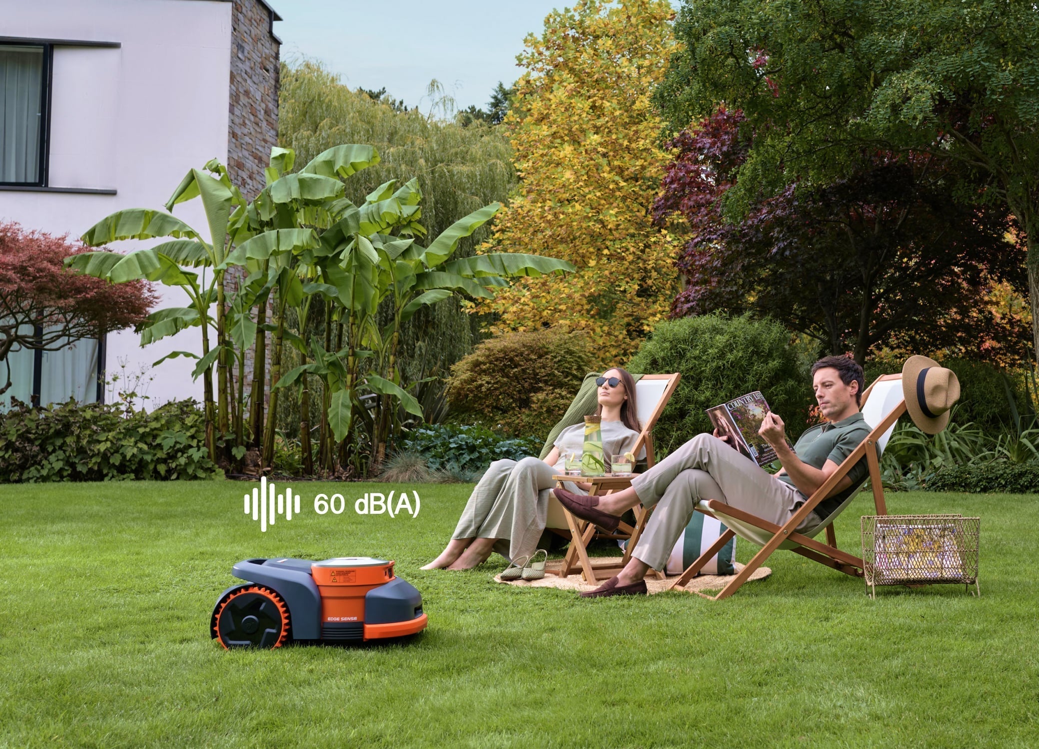 Navimow i110E robot lawn mower mows grass for the couple.