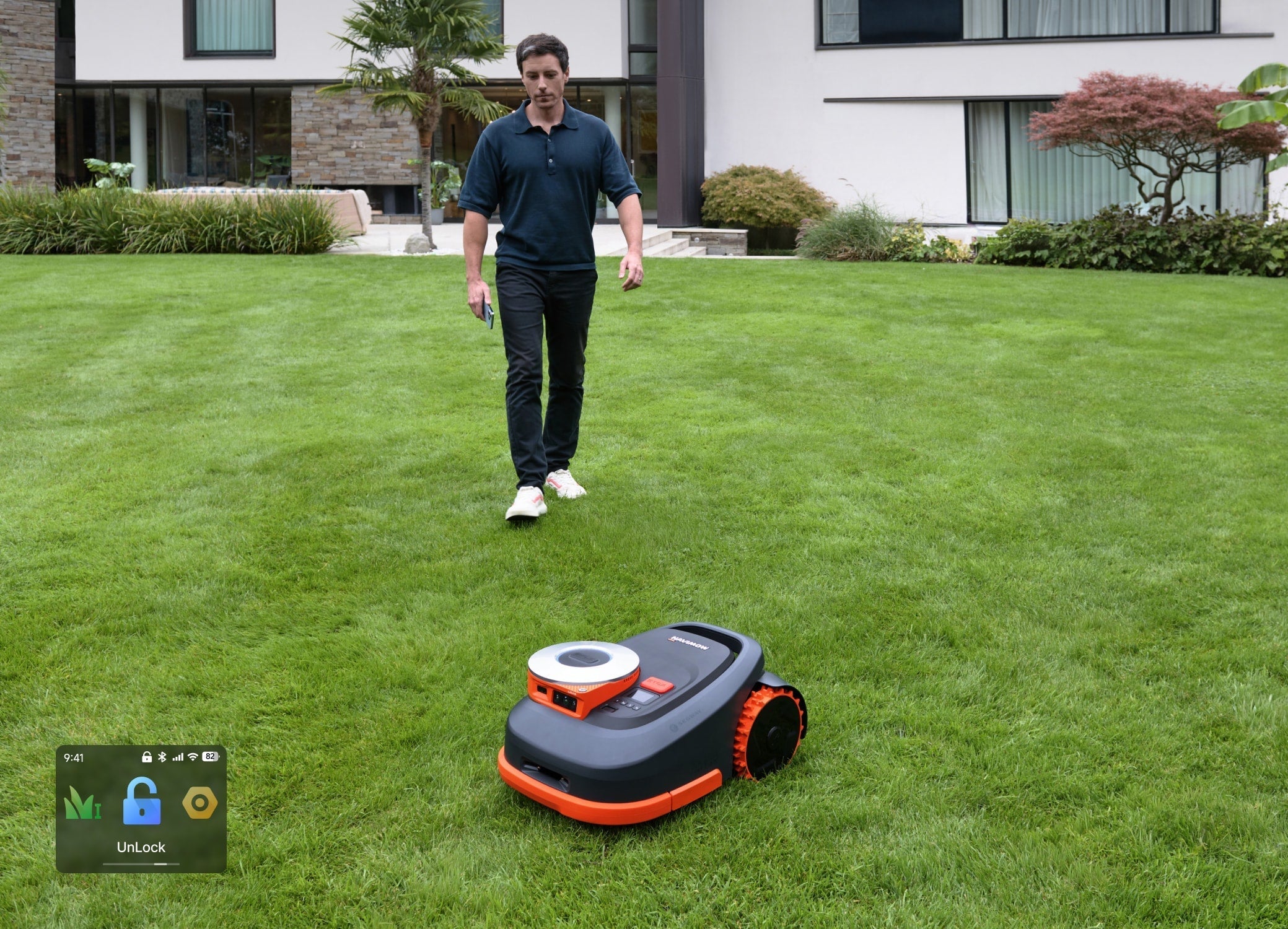 Navimow i110E robot lawn mower mows a large green lawn.