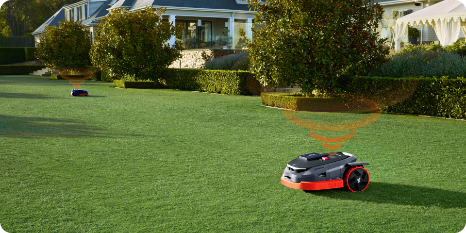 Navimow i110N robot lawn mower on a large green lawn.