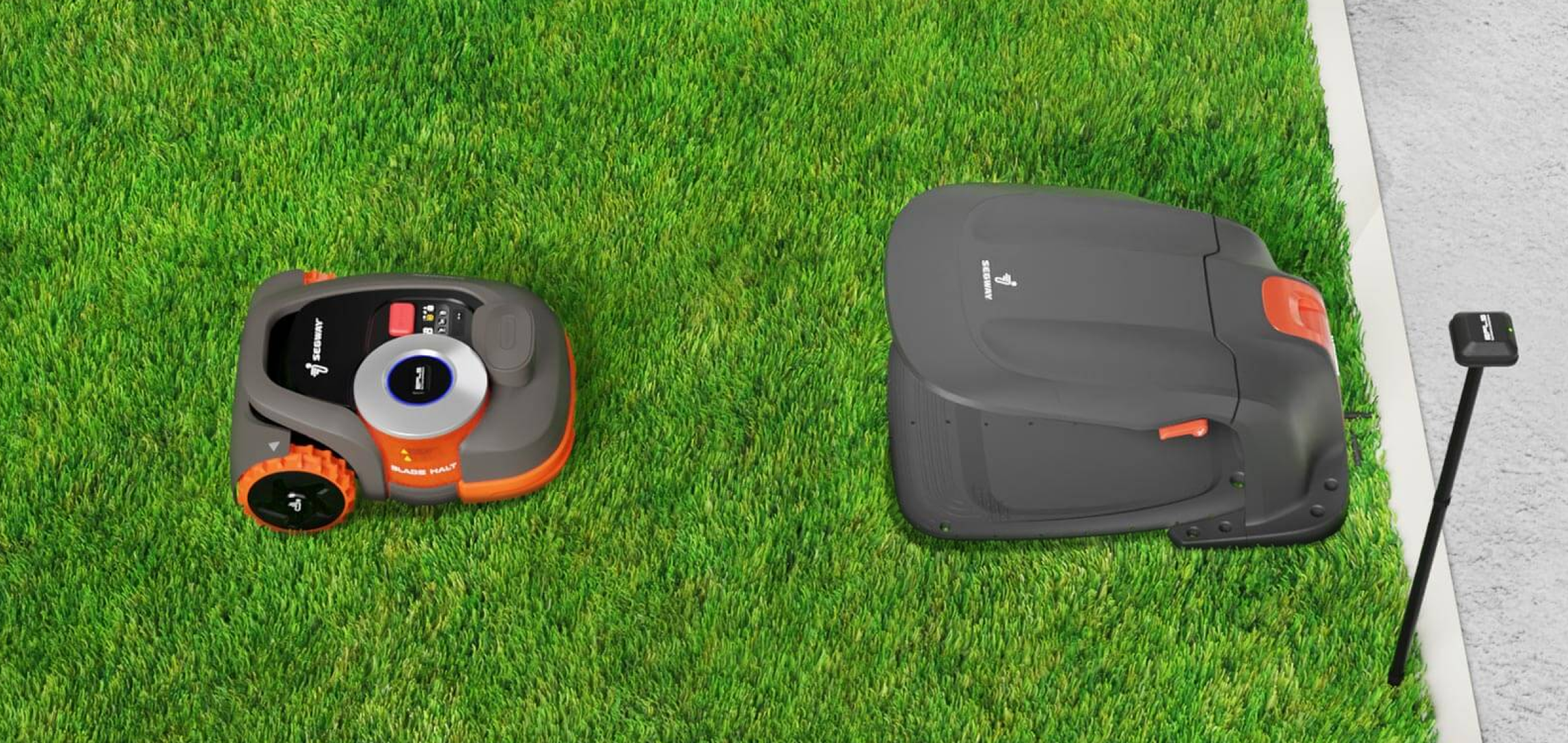 Segway Navimow robot lawn mower is on the green grass.