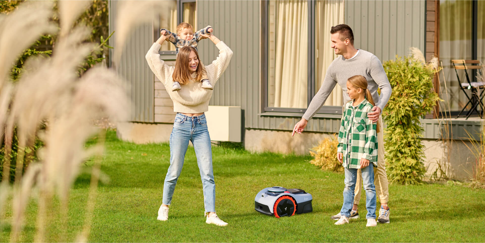 A happy family with the Navimow i105 robot lawn mower.