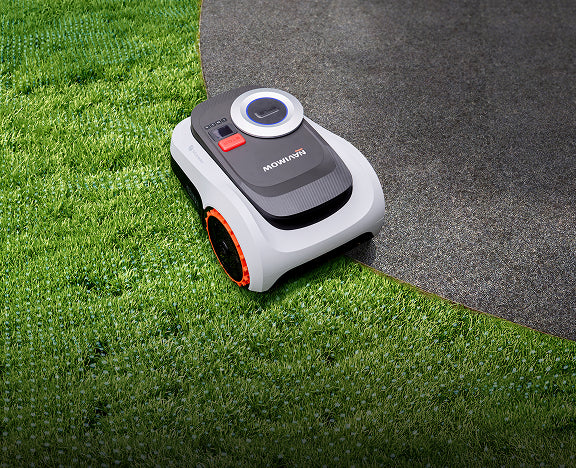 Segway Navimow i110E robot lawn mower on a green lawn.