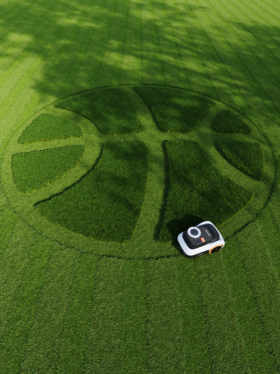 Navimow i110N robot lawn mower mows basketball pattern in grass.